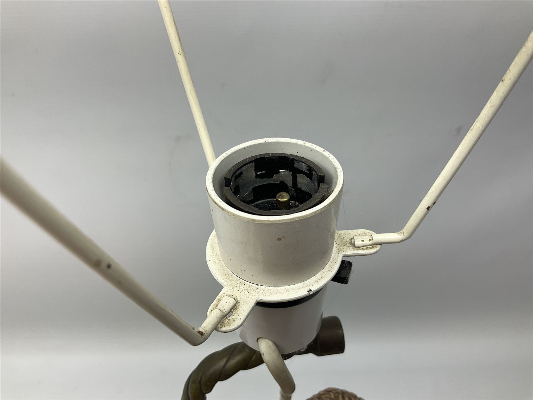 Composite table lamp modelled as a Roman Emperor donning blue robes, upon quatrefoil base modelled with rams heads and winged cherubs, H56cm excl fitting