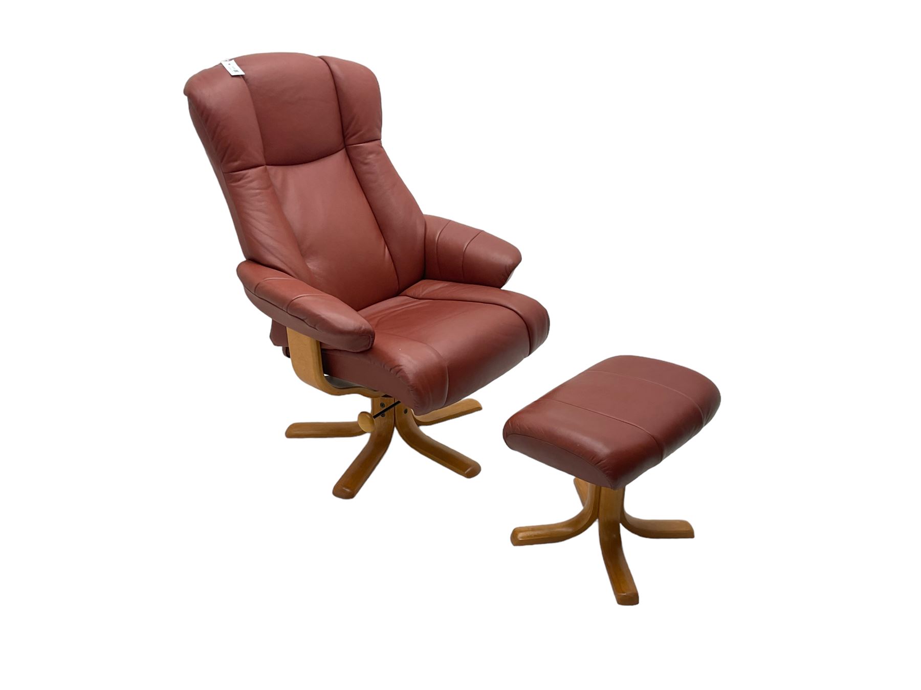 Mid-20th century design reclining armchair with swivel action, upholstered in red leather, raised on U-shaped supports with quadruform base, with matching footstool
