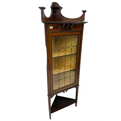 Edwardian inlaid mahogany corner cabinet, fitted with single astragal glazed door enclosing two shelves, flanked by satinwood banding, on square tapering supports united by undertier