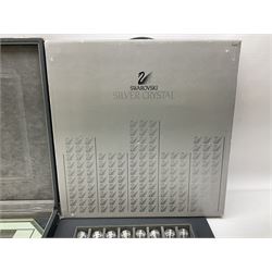 Swarovski silver crystal cut glass chess set, with clear and black pieces on mirrored board, in original presentation box 