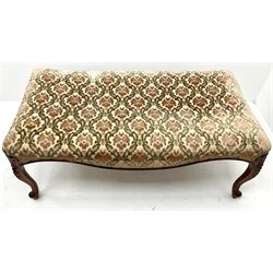 Large French style stool, upholstered in a beige ground floral patterned fabric, apron, floral carved cabriole feet 
