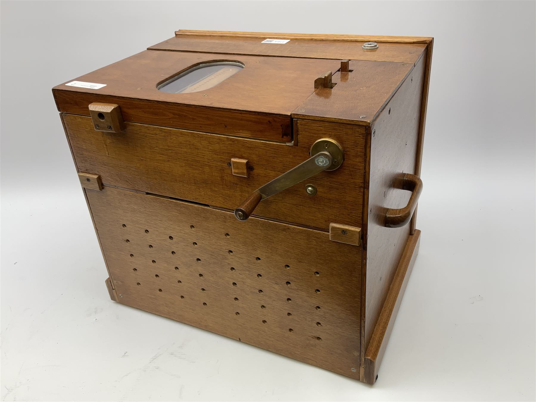 Small scratch built wooden John Smith style twenty-note busker organ with thirteen paper music rolls, other paper music and soft toy monkey