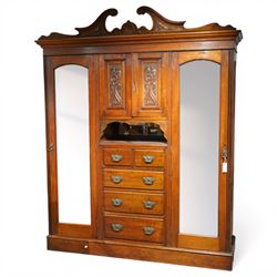 Edwardian walnut triple combination wardrobe projecting pediment with foliate scroll, cres...