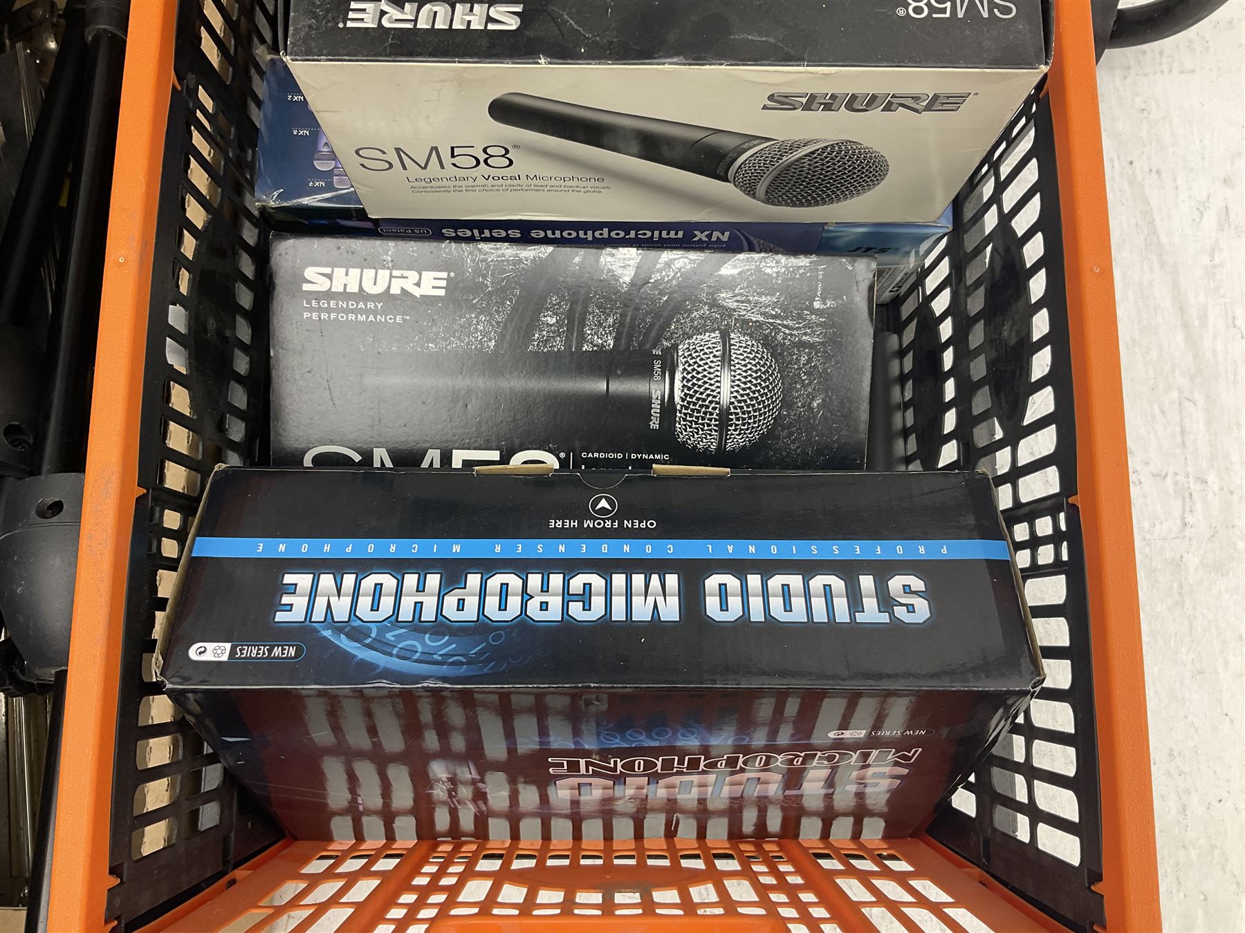 Two Shure SM58 microphones, Gatt Audio DM-700 microphone, other boxed and unboxed microphones and various microphone and music stands