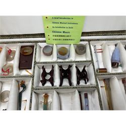 Chinese boxed collection of miniature polished hardstone musical instruments with hardwood stands