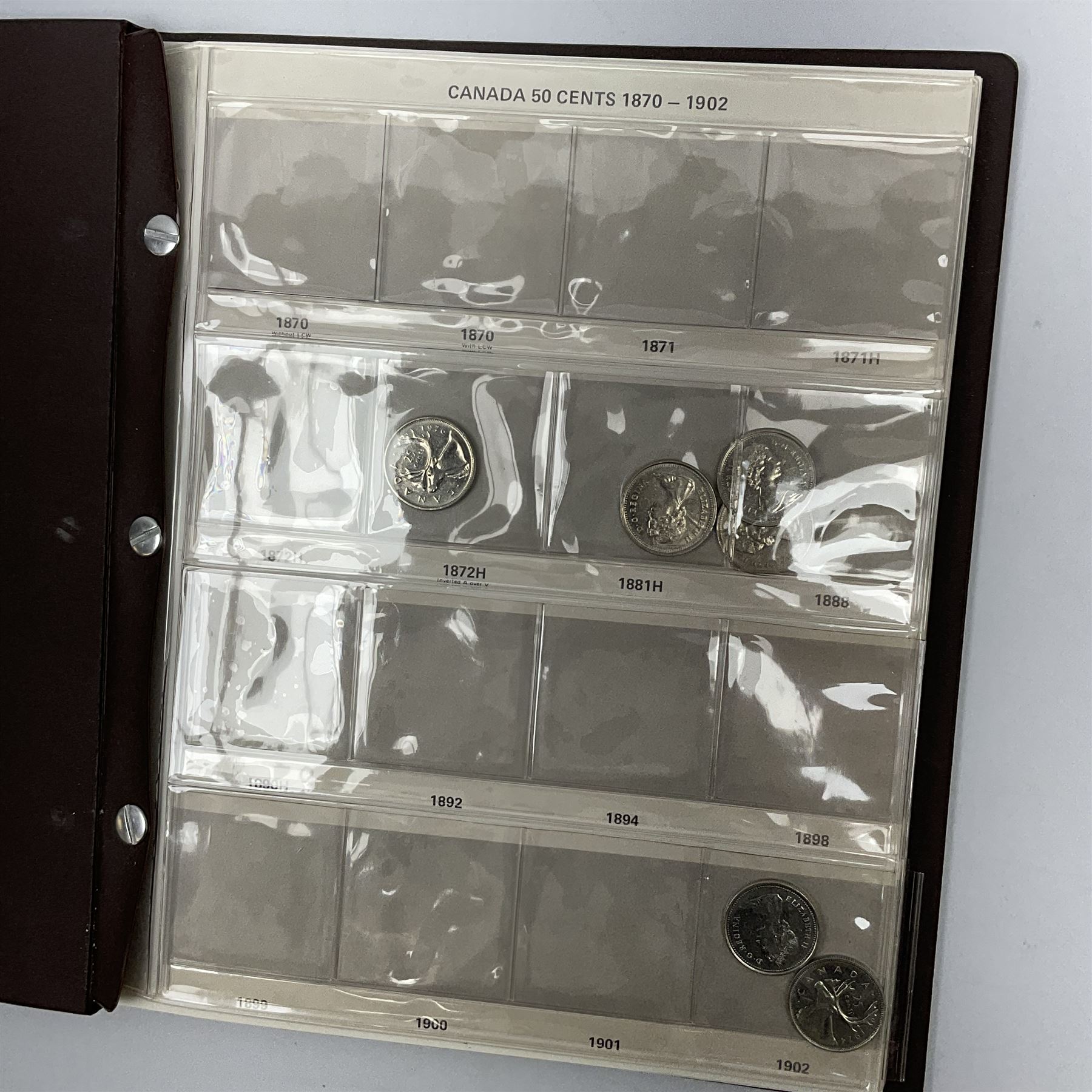 Mostly Canadian coins including 1967 six coin set, various Canadian 50 cent coins, various nickels, Royal Canadian Mint 1990 specimen coin set in blue folder with outer sleeve, various Canadian dollars etc, in folders and loose