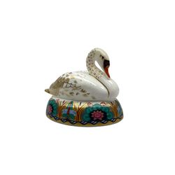 Three Royal Crown Derby paperweights, comprising bald eagle with silver stopper, swan with silver stopper and crown namestand with gold stopper  