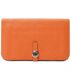 Hermès - Dogon Duo wallet, orange Togo leather, with palladium-plated Clou de Selle fasten...