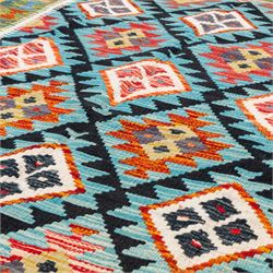 Afghan kilim cyan ground rug, the field with repeating lozenges containing geometric amber and ivory motifs with dark indigo borders, the citrine border with further geometric designs of contrasting tones