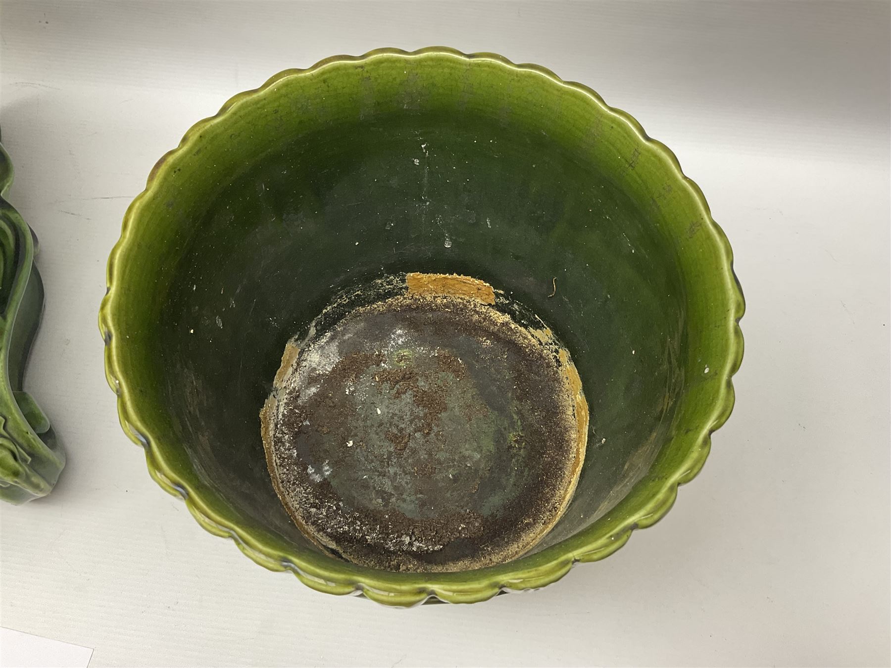 Jardiniere and stand, the jardiniere modelled as a pale, the stand with foliate and foliage decoration on a green ground, stand H73cm 