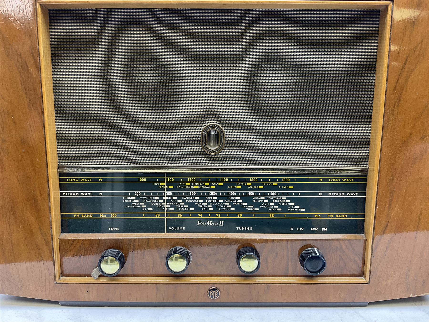 1955 Pye Fenman II valve radio in walnut veneered case, W58cm, together with a 1950s McMichael Type 854 valve radio with Bakelite knobs, W47cm H39cm D24cm, and 1957 Ekco Type A320 radio in dark walnut veneered case (3)
