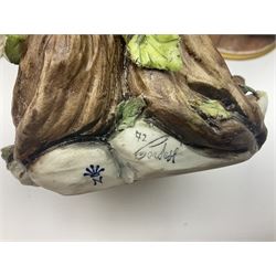 Three Capodimonte figures, to include The Kind Heart Man, modelled by Cortese as a tramp with two doves, The Young Falconer by Maria Angela and another modelled as a tramp darning his socks, all with printed marks, tallest H39cm