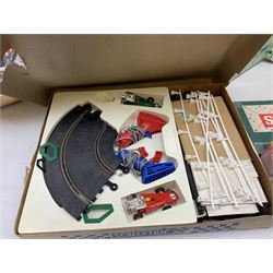Boxed Scalextric set No. 31, together with additional track, model train accessories and board games including Scrabble 