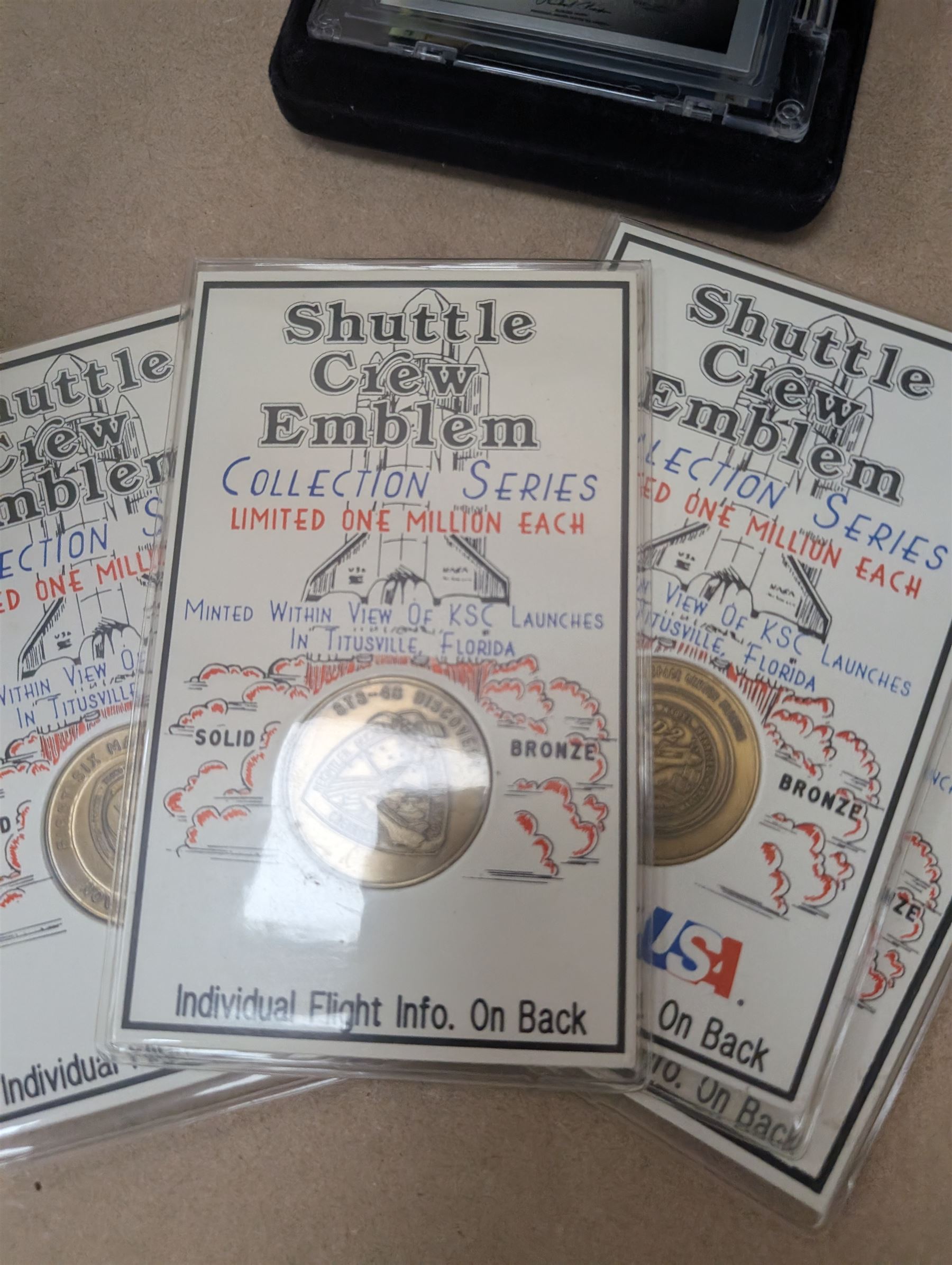 Nasa Space Shuttle program commemorative items, including album of stamp covers, telephone cards, five Shuttle Crew Emblem Collector's Series medallions, Maiden Flights bronze medallions, Missions of the Orbiter Challenger set of medallions and Apollo series medallions