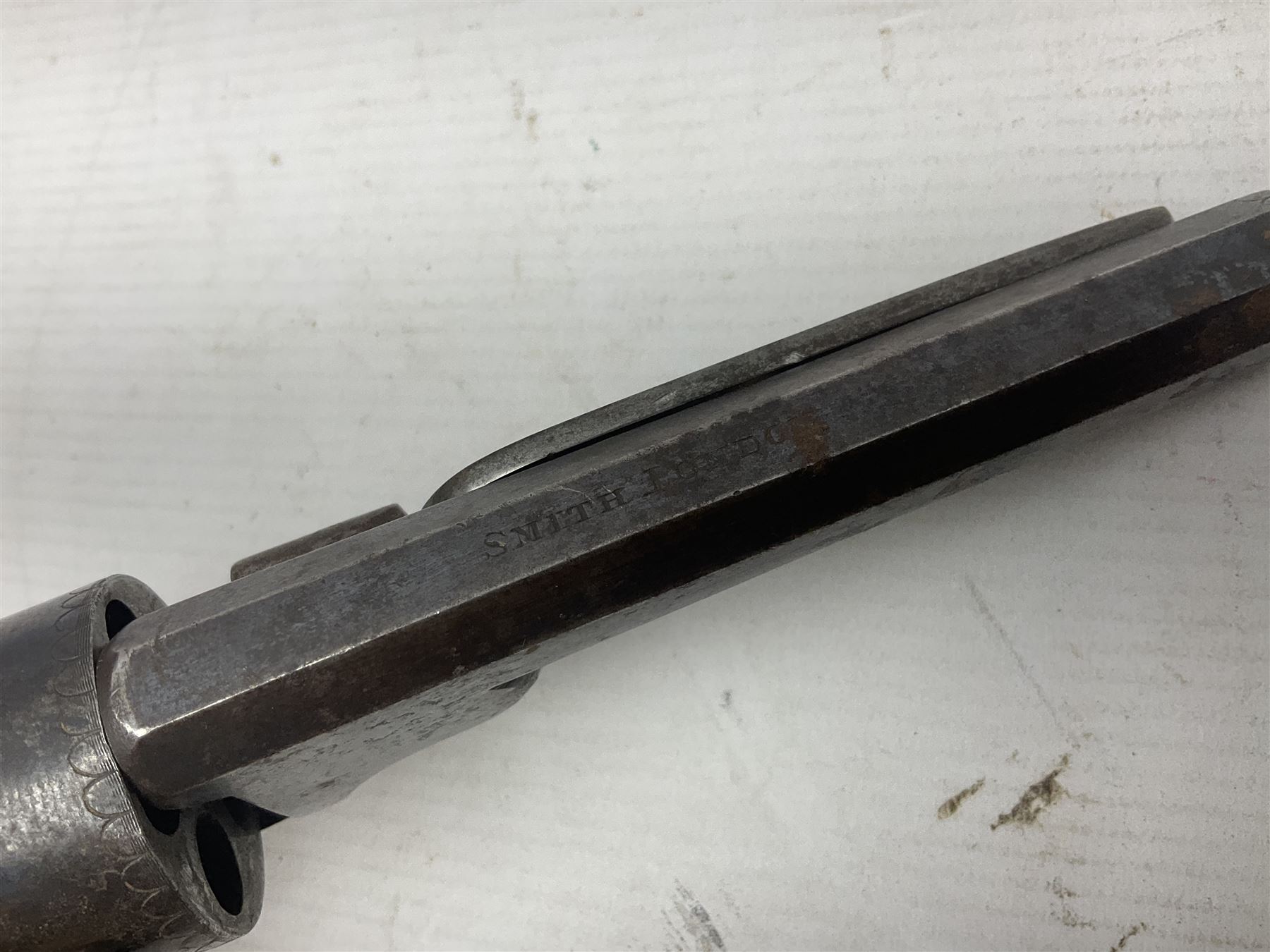 Mid-19th century Smith London .36 cal. transitional five-shot percussion revolver, the 12cm rifled octagonal barrel with side loading lever, side safety, some engraved decoration and chequered two-piece grip L28cm overall