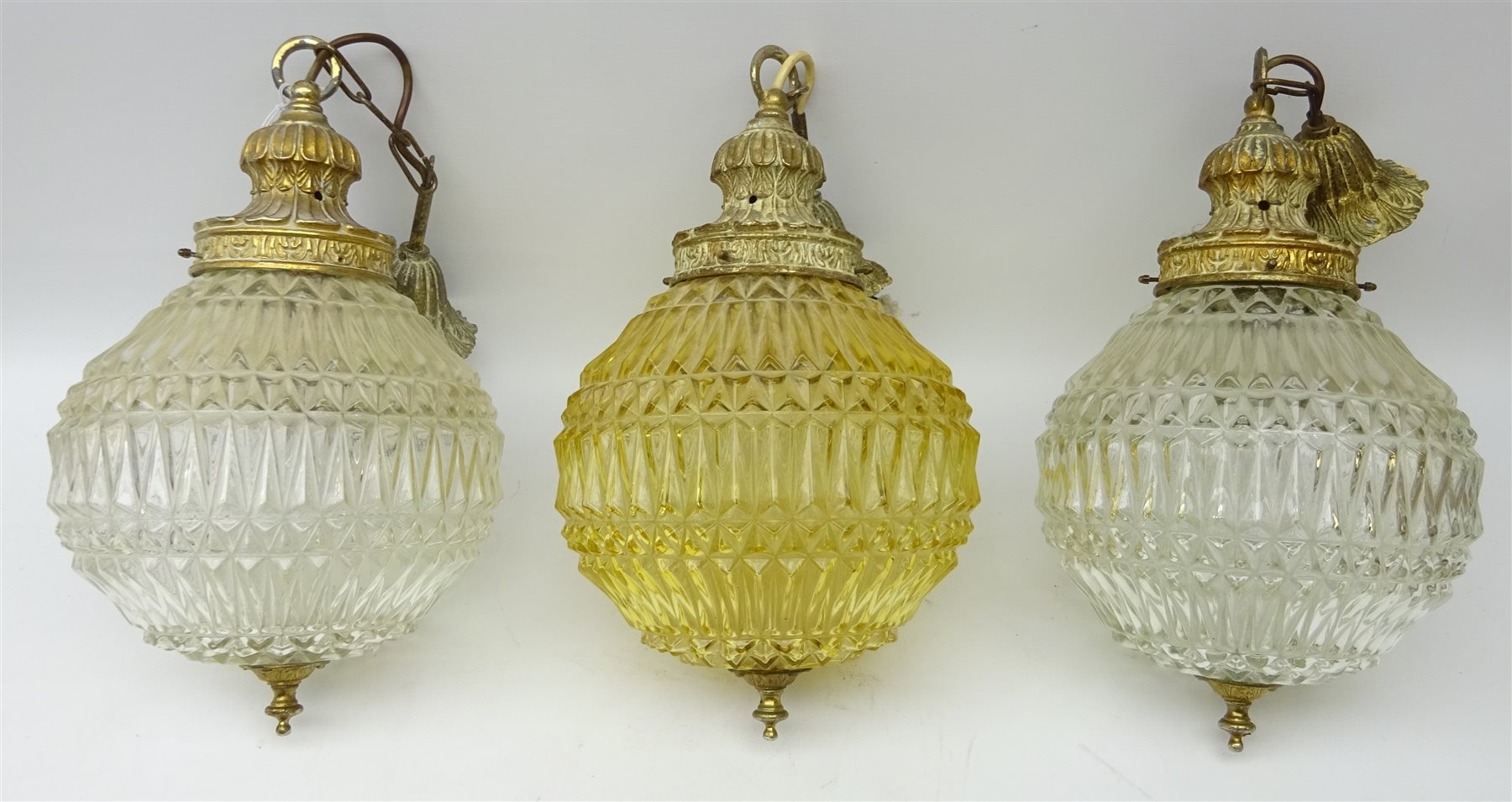 Set of three matching moulded glass light fittings with foliate cast