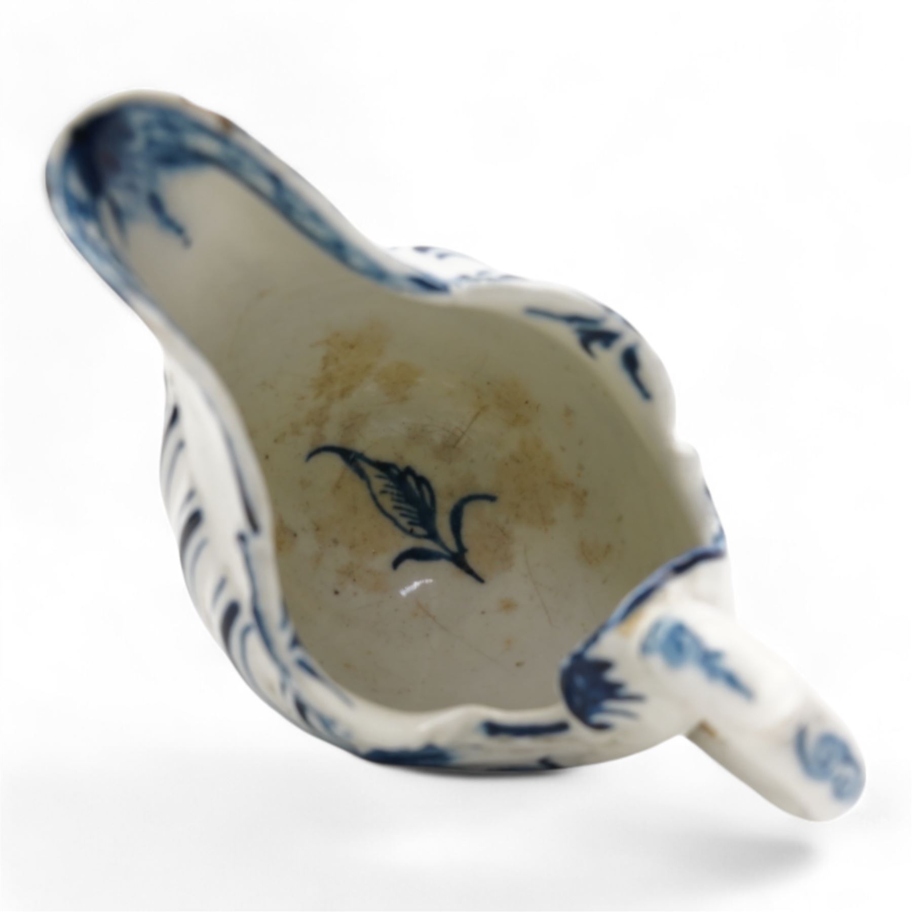 18th century Derby blue butter boat, circa 1770, of helmet form, moulded with shells and dolphin lip, on pedestal foot, H8.5cm x L9.5cm 