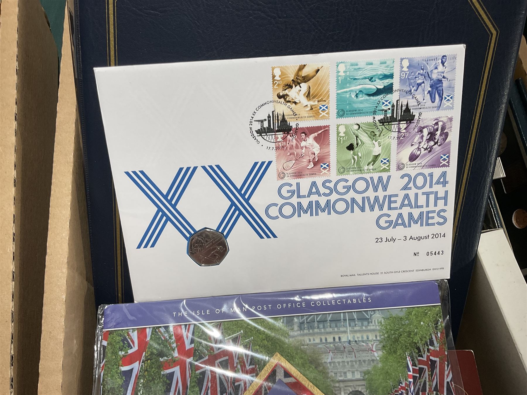 Approximately one hundred and fifteen Royal Mint coin covers, in two ring binder folders and loose, together with approximately 53 grams of Great British pre-1920 and approximately 68 grams of Great British pre-1947 silver threepence coins, and a small quantity of further pre-decimal coins