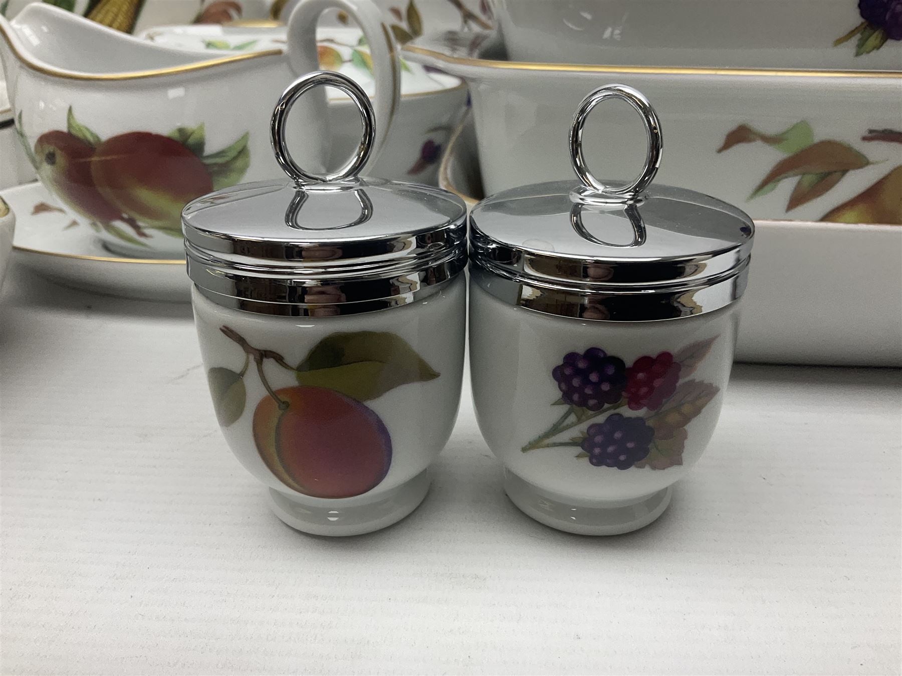 Royal Worcester Evesham pattern, including covered pot de cremes, twin handle tureen, serving dishes, flan dishes, side plates etc  