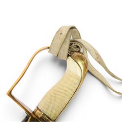 British 1976 pattern cavalry officers' saber variation of  private purchase, the 76cm single edged blade extremely curved, brass stirrup hilt with chequered ivory grip the languets bearing military trophies, with original buck skin sword knot, the leather scabbard has three brass mounts with twin suspension rings, the top mount bears makers cartouche of 'Tatham to his Majesty, Charing Cross London', 1800-1860, overall L90cm  This item has been registered for sale under Section 10 of the APHA Ivory Act 