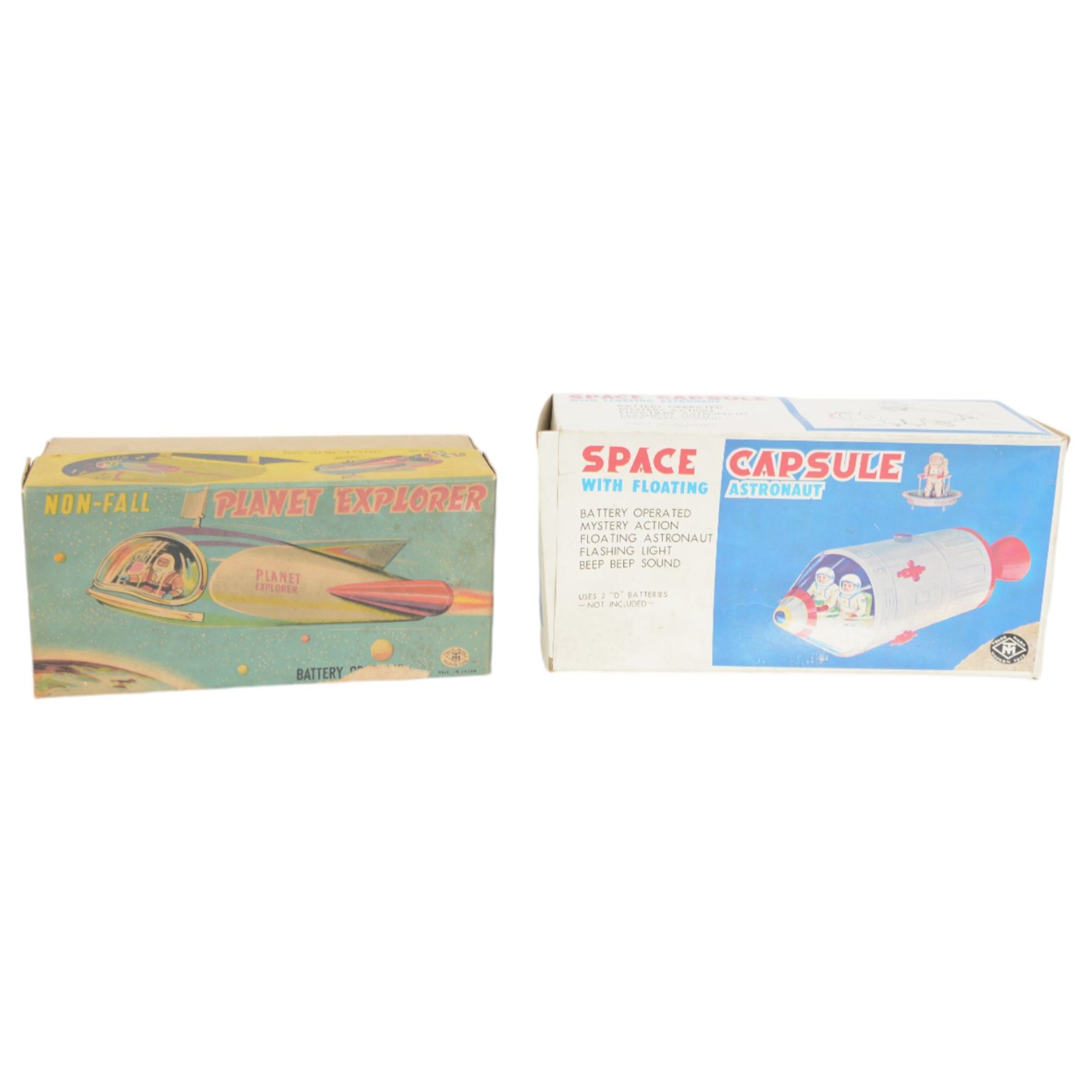 Two Japanese battery operated tinplate rockets by Modern Toys