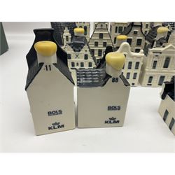 Twenty seven KLM Bols Blue Delft's decanters in the form of Dutch houses, some with contents