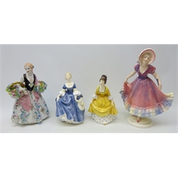  Two Royal Doulton figures 'Coralie HN 2307' and 'Hilary HN 2335', Luigi Fabris model of a lady holding baskets of flowers and a Hertwig & Co figure of a young woman, H26.5cm (4)  