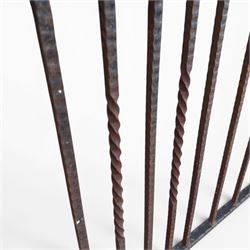 Victorian wrought iron vineyard gate, with ornate scrollwork and foliate acanthus leaf decoration, shaped cresting and central decorative panel, finished in rustic black painted finish