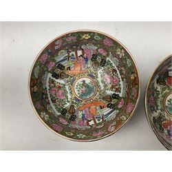 Pair of Chinese famille rose bowls, decorated with reserves of figures in domestic scenes, birds, foliage and flowers, upon a gilt ground, with character marks beneath, D20cm