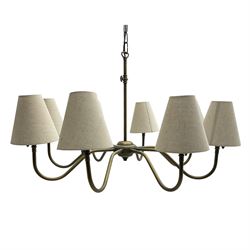 Burnished brass finish eight branch chandelier light fitting, each branch with conical fabric shade