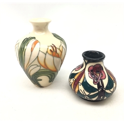  Two small Moorcroft vases, the first of baluster form decorated in the Crocus pattern, with impressed and painted marks beneath, H10cm, the second smaller example decorated in the Melody pattern, with impressed and painted marks beneath, signed Sian Lepper, H6cm.   