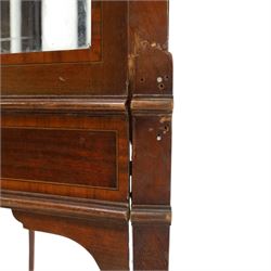 Edwardian inlaid mahogany display cabinet of rectangular canted form, galleried top with crossbanded inlay, above a glazed cabinet enclosing  baize lined shelves, raised on square tapering legs terminating in spade feet  