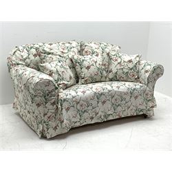 Early 20th century two seat settee with drop arm, upholstered in Sanderson 'Absalon Minor' fabric, loose covers and cushions, white ground with overall floral design