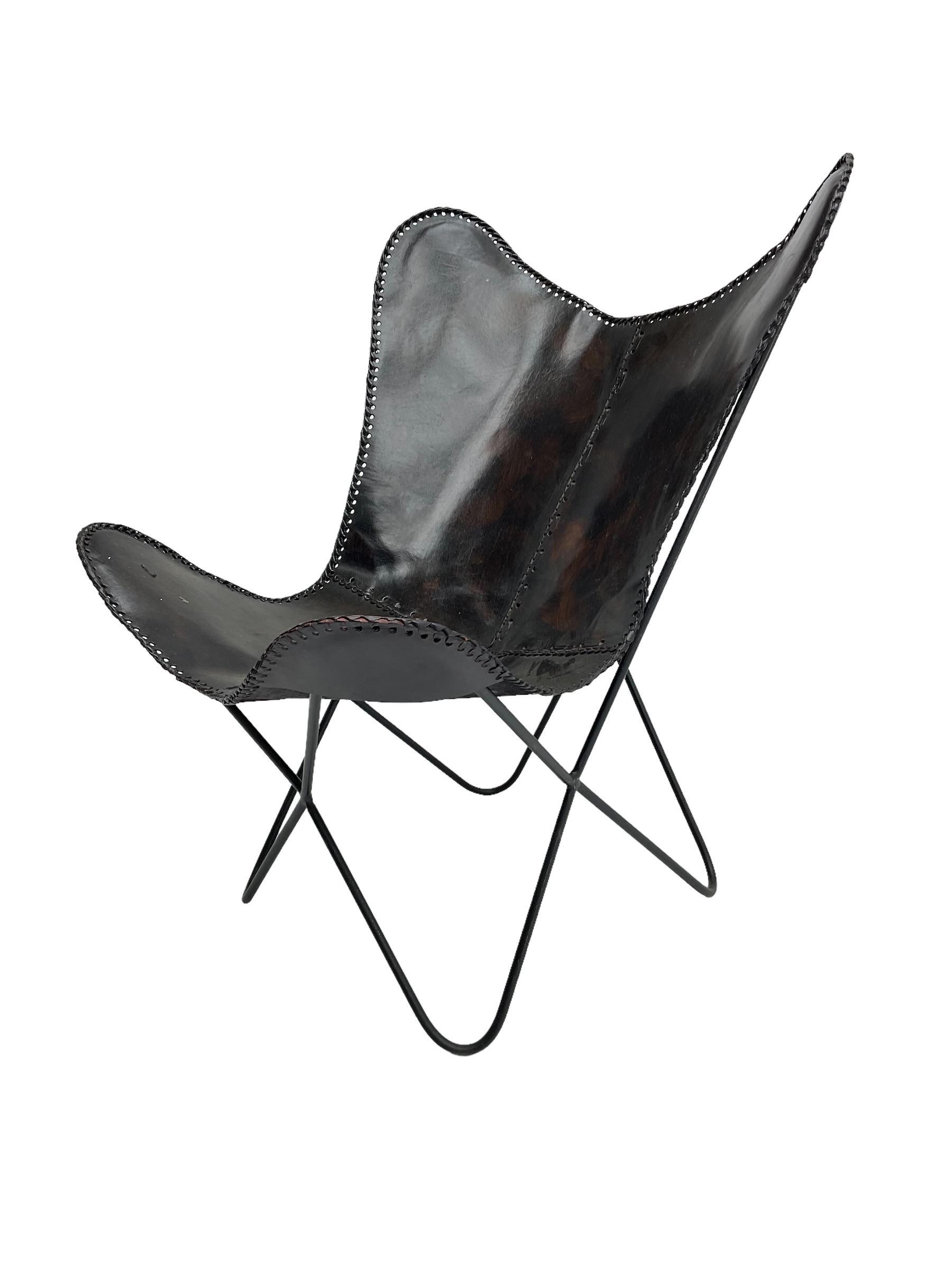 Butterfly Chair, black finish metal frame with stitched slung leather cover