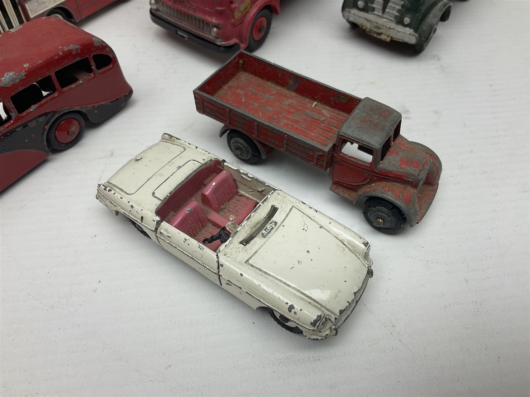 Dinky - sixteen unboxed and playworn die-cast models to include Single Deck Bus, two Atlantean Buses, Ford Transit Van, 10 Ton Army Truck, MGB Sports Car, Telephone Service Van etc 