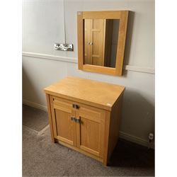 Light oak side cabinet and wall mirror- LOT SUBJECT TO VAT ON THE HAMMER PRICE - To be collected by appointment from The Ambassador Hotel, 36-38 Esplanade, Scarborough YO11 2AY. ALL GOODS MUST BE REMOVED BY WEDNESDAY 15TH JUNE.