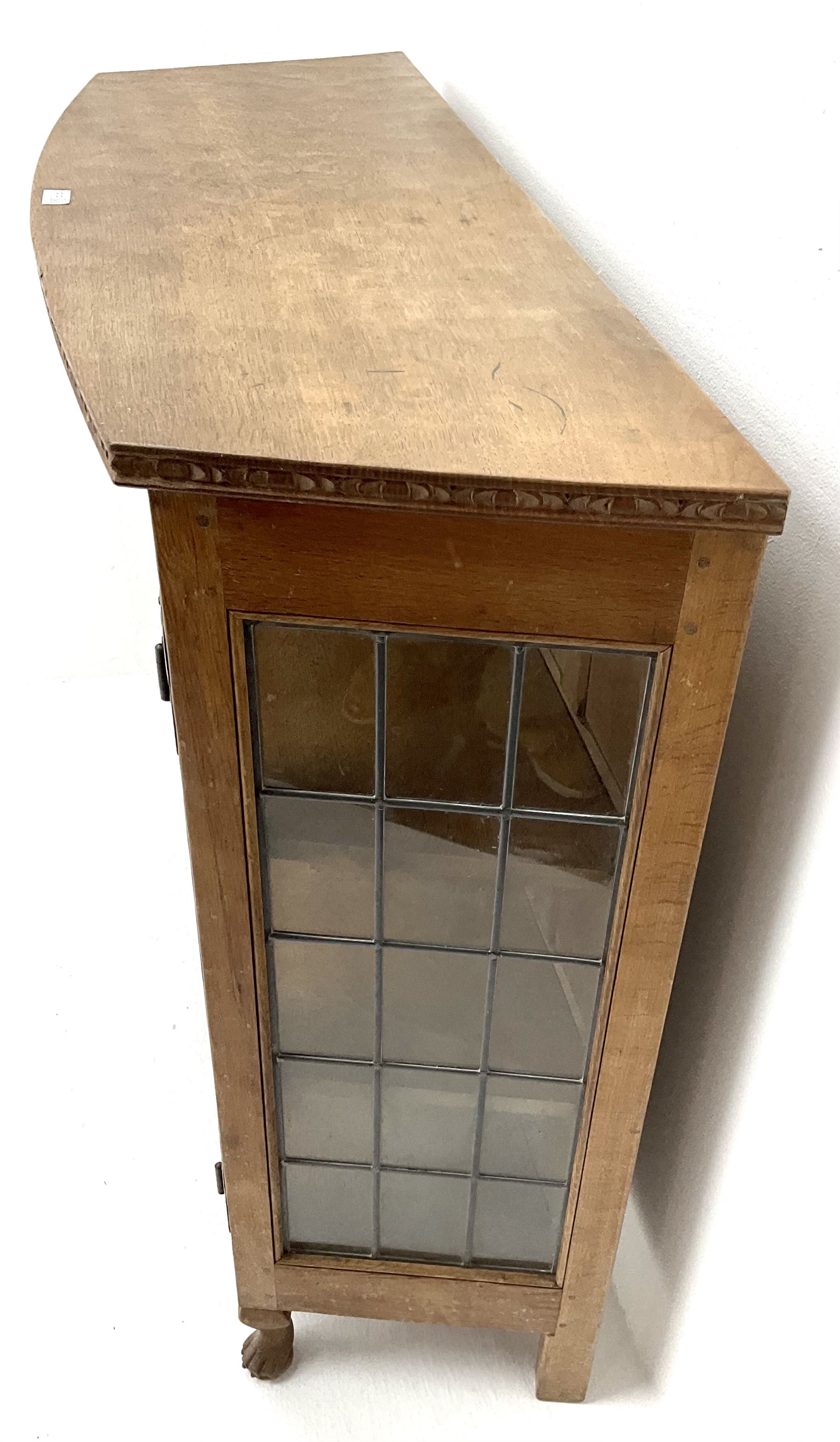 David 'Oakleaf man' Langstaff of Easingwold Yorkshire oak cabinet, egg and dart detailing, with two lead glazed doors enclosing two shelves, bearing oak leaf signature, cabriole claw feet