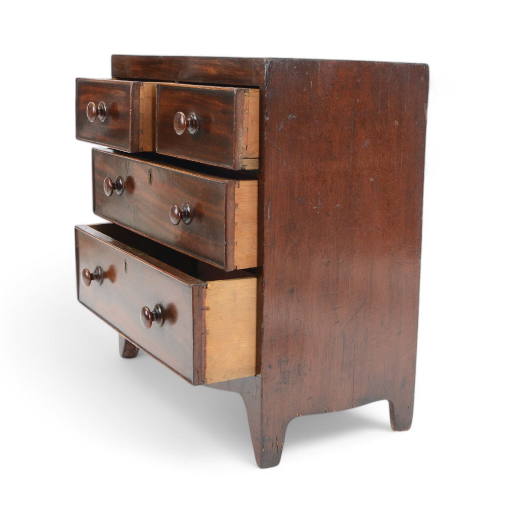 Victorian mahogany 'apprentice piece' miniature chest, rectangular top over two short and two long cock-beaded drawers with turned handles, shaped apron and bracket feet 