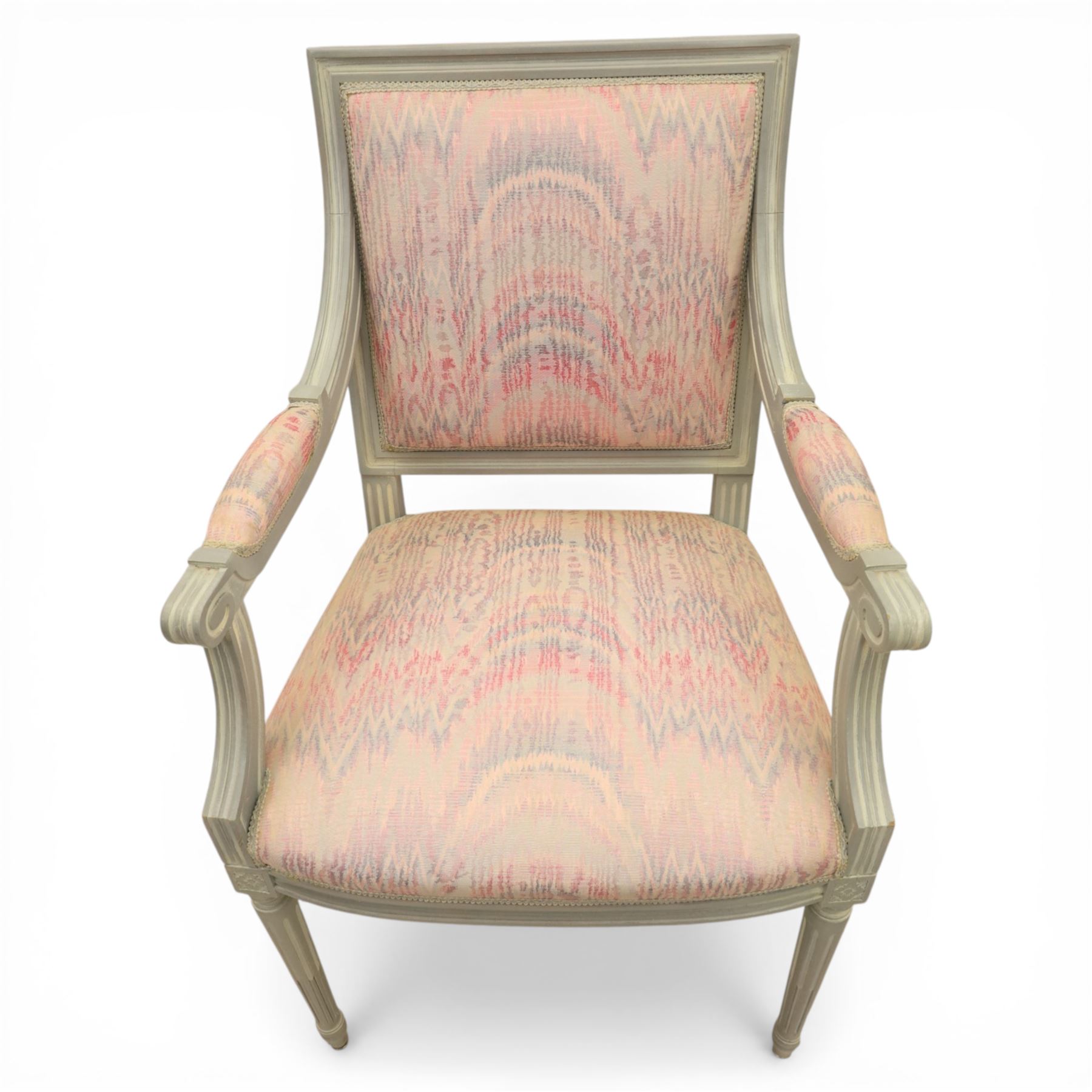 Set of two French design fauteuil armchairs upholstered in pink fabric, one with oval medallion back and padded arms on fluted tapering supports (H 97cm, W 58cm, D 54cm), the other with rectangular padded back, scroll arms and fluted tapering supports (H 99cm, W 60cm, D 60cm)
