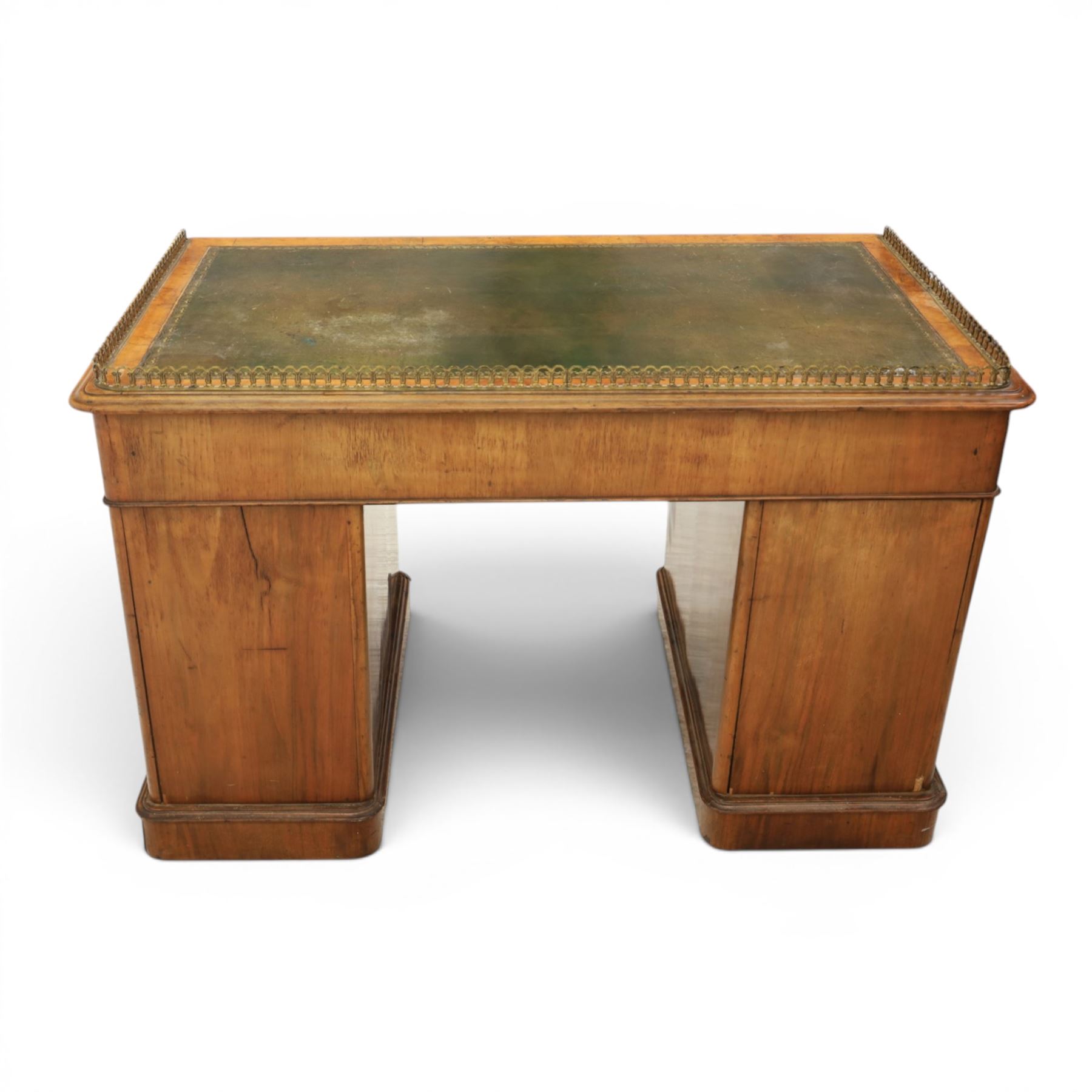 Victorian figured walnut twin pedestal desk, brass galleried top with inset tooled green leather writing surface, above three frieze drawers, raised on two pedestals with three drawers, on plinth bases above castors