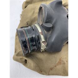 RAF Flight Lieutenant's uniform with peaked cap and WW2 ribbon bar; WW2 gas mask in blue canvas bag dated 1942; flying helmet date 1984; and British Army Major's uniform with Staybrite buttons and peaked cap