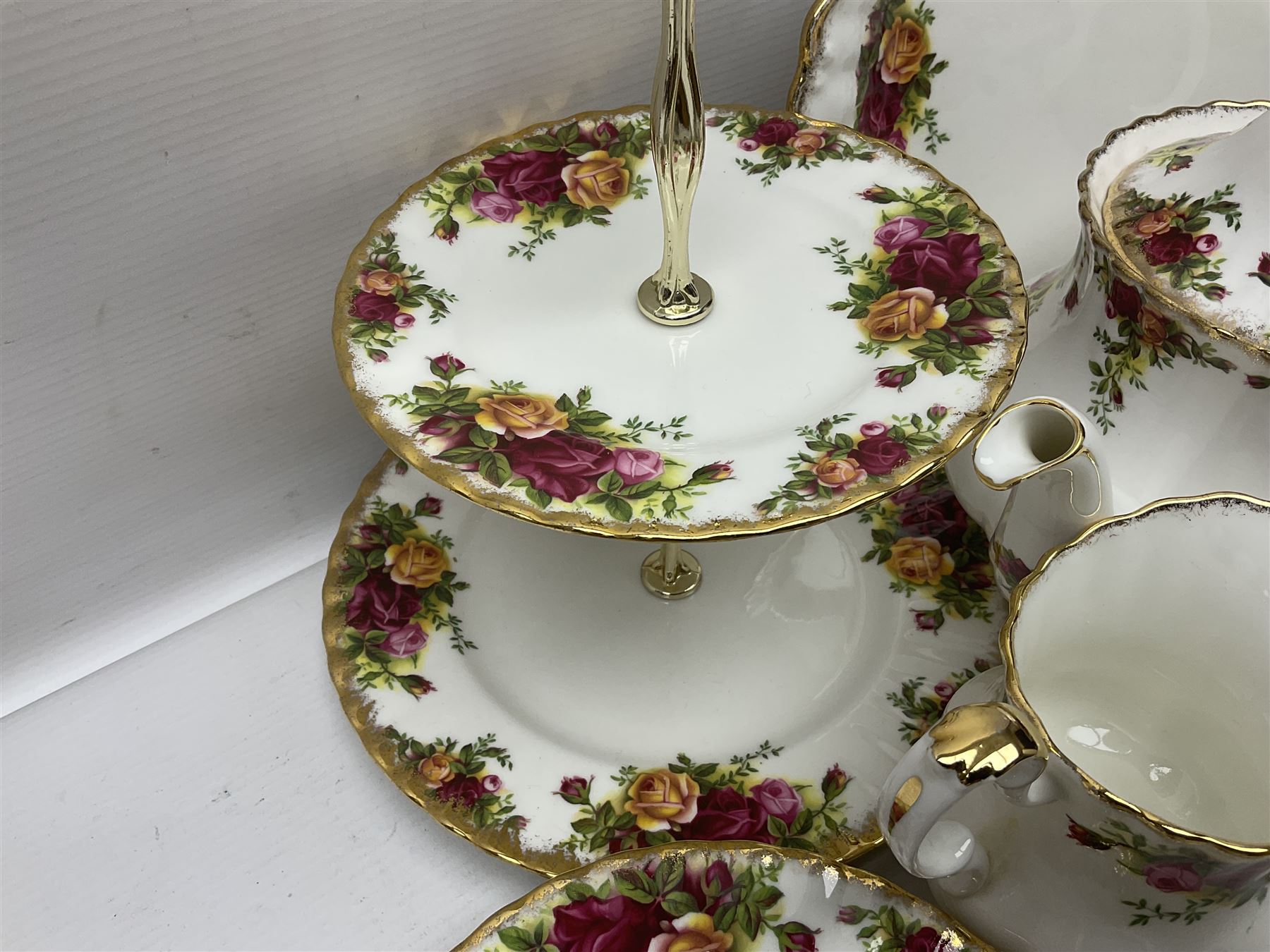 Royal Albert Old Country Roses pattern tea service for six, comprising teapot, sucrier, milk jug, dessert plates, one cake plate, one two tiered cake stand, salt and pepper pots and bud vase 