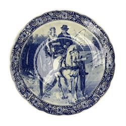 Large Delft charger, in blue and white glaze, decorated with a couple riding in a horse drawn cart, D40cm