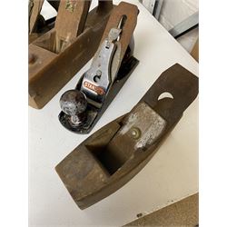 Collection of woodworking planes and other vintage tools, including Stanley and Salmans examples