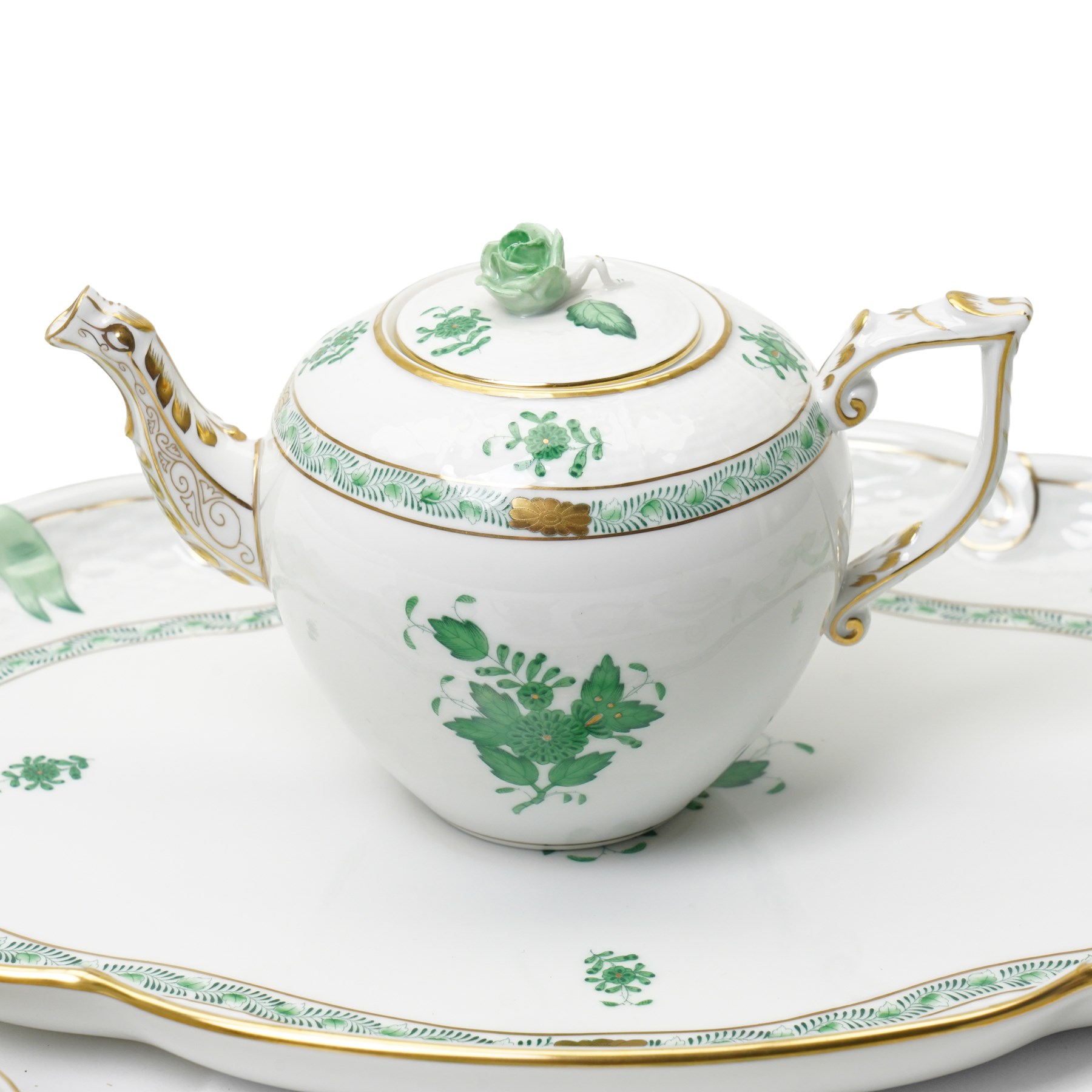 Herend porcelain Tete a Tete decorated in the green Chinese Bouquet pattern, comprising cabaret tray, two cups and saucers, tea pot, leaf shape bowl and milk jug