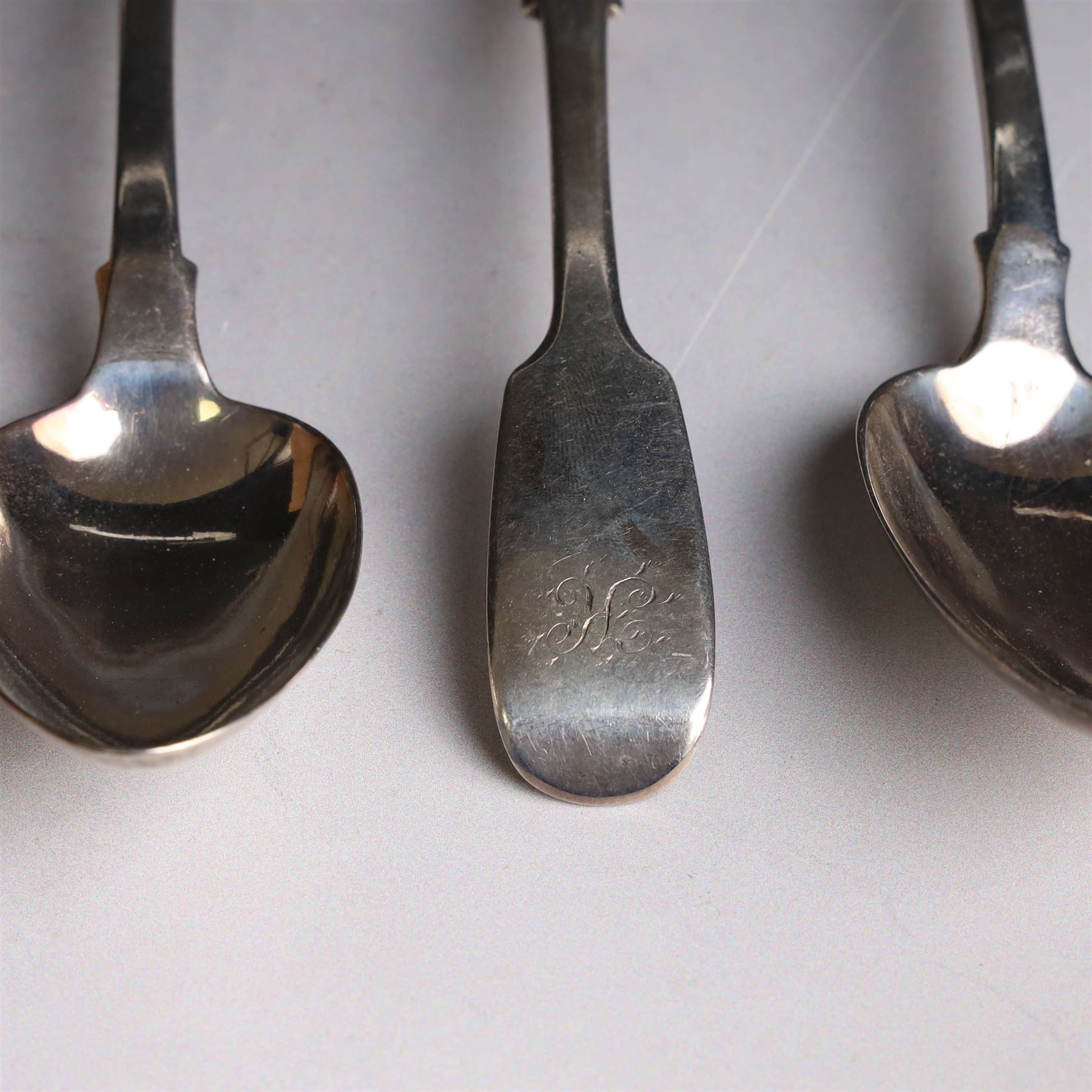 Eight Victorian silver Fiddle pattern dessert spoons, all with engraved initials to terminal, including a set of six York silver spoons, hallmarked James Barber & William North, York 1844 
