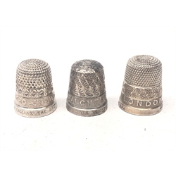  Three 'The Spa' silver thimbles, relief decorated London, Stratford on Avon and Colchester, two stamped Sterling, one Birmingham 1930, (3)  