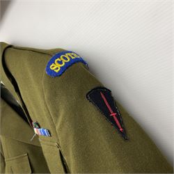 Two post-WWII British Army No.2 Dress tunics, one with Green Howards buttons; army shirt dated 1951; Royal Fleet Auxilliary jacket with trousers; three RAF/WAAF uniforms and RAF Greatcoat; and three canvas/webbing bags, two dated 1943 & 1945