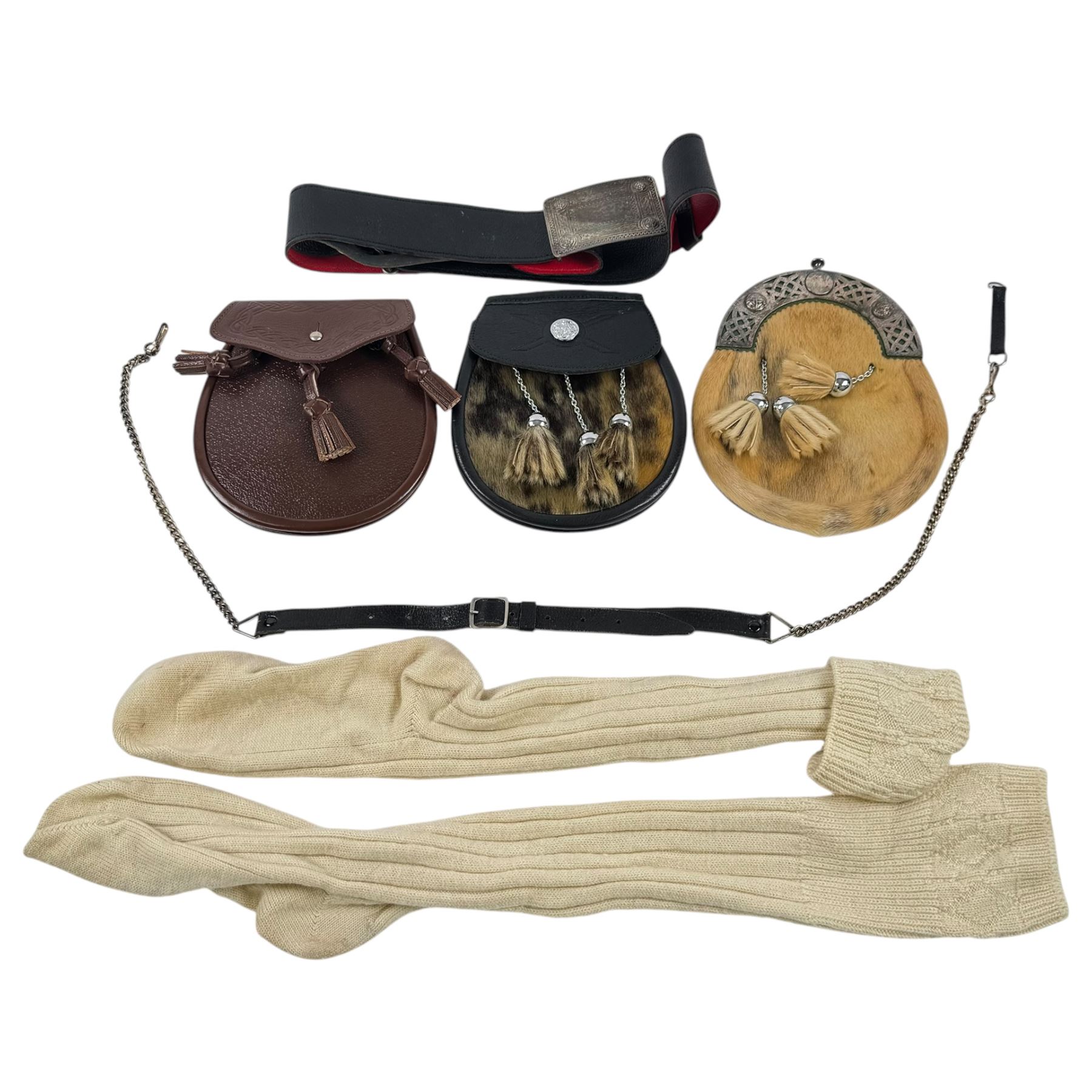 Set of three tasselled leather Sporrans, one with chrome plated mounts and two with fur, together with kilt set