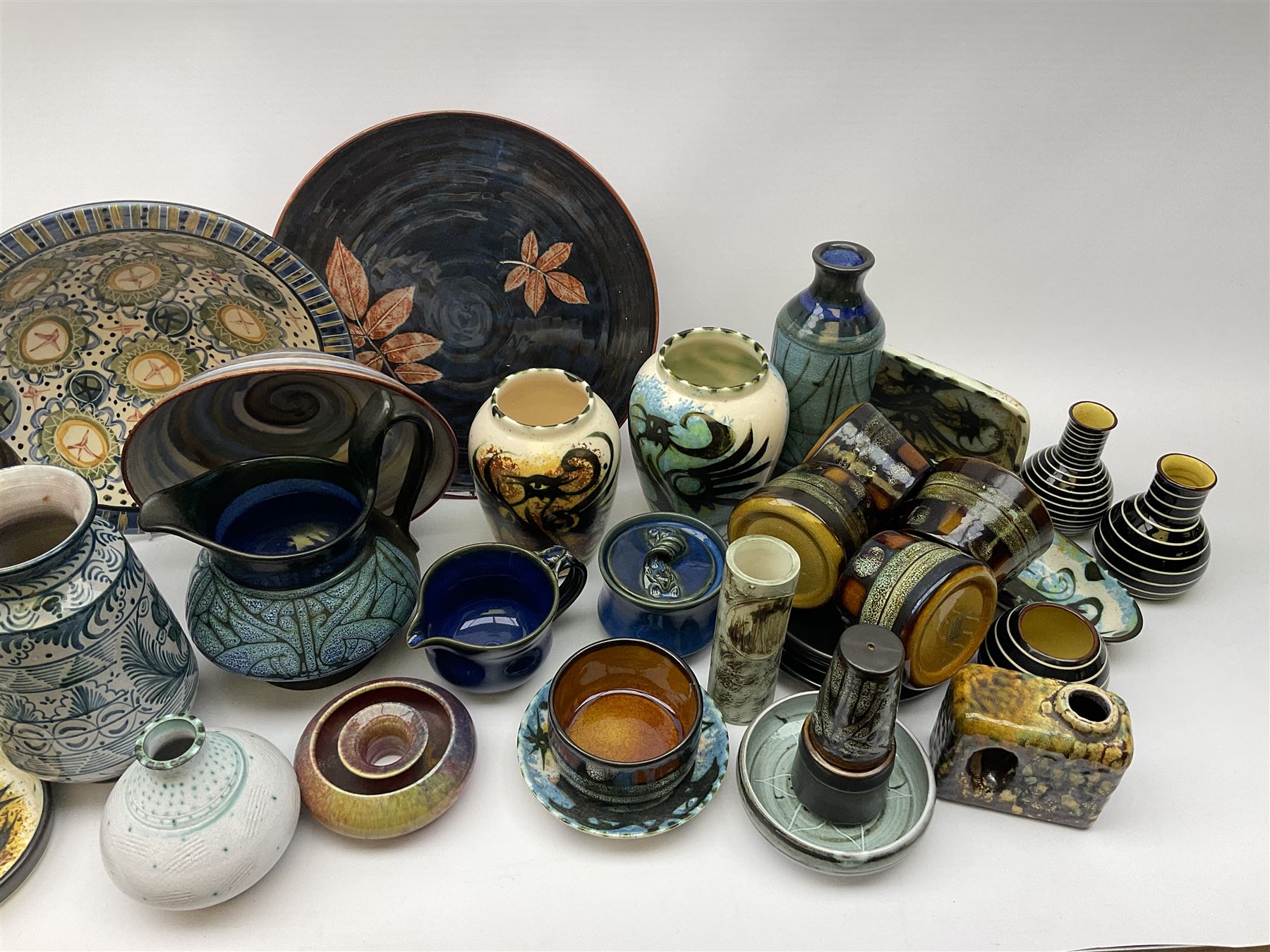 A group of assorted Studio Pottery, to include various Cornish Celtic Pottery, Wold pottery bowl, Micklegate pottery bowl, a small Troika style vase of cylindrical form, etc. 